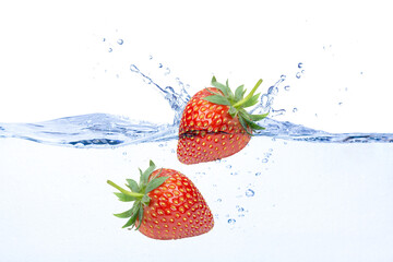 Fresh strawberry in water splash isolated on white background.