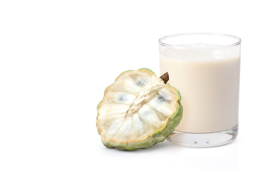 Custard apple with glass
of milk shake isolated on white background. Copy space.