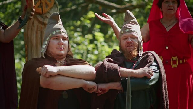 mystical fraternal rite on the blood of two warriors. the priestess and the shaman supervise the execution process.
