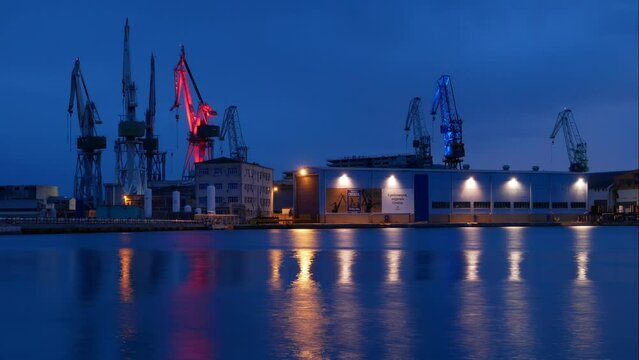 The bankrupt shipyard in Pula. Time lapse of the last lit cranes at nightfall