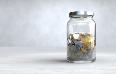Coins in a glass jar, Money saving concept.