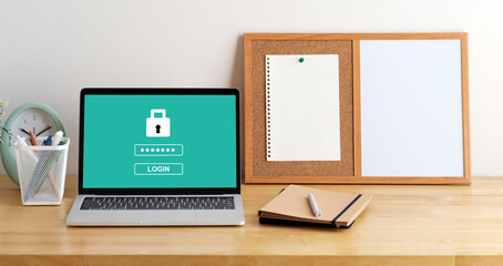 Laptop computer with password login on screen, cyber security concept