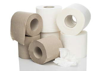 Rolls of toilet paper made from virgin cellulose and recycled materials stacked on a white isolated background