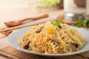 Rice vermicelli noodles stir-fried with boiled pumpkin. - obrazy, fototapety, plakaty