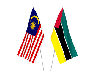 National fabric flags of Malaysia and Republic of Mozambique isolated on white background. 3d rendering illustration.