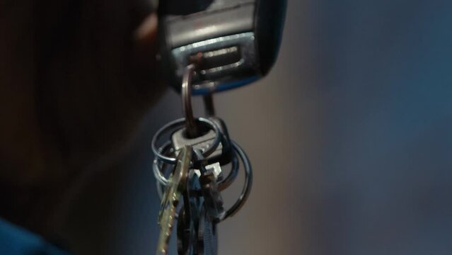 Shallow depth of field shot the jingling of a set of keys.