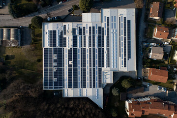 Industrial building with solar panels on the roof top for green energy production