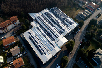 Industrial building with solar panels on the roof top for green energy production