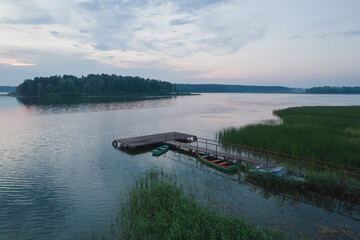 Pier on the lake. Summer evening