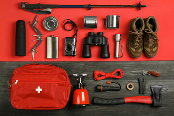 Flat lay composition with different camping equipment on color background. Traveler set