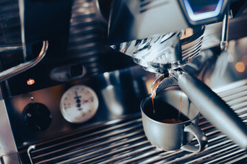 Close-up image of the coffee machine in a coffee shop or restaurant. Barista making coffee...