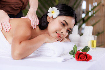 Obraz na płótnie Canvas close up beautiful young asian woman lying relaxing in the spa salon massage, health and body care concept,