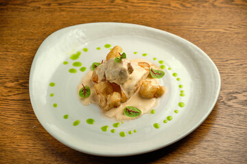 Chicken breast fillet with white sauce and olive oil