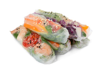 Many different rolls wrapped in rice paper on white background