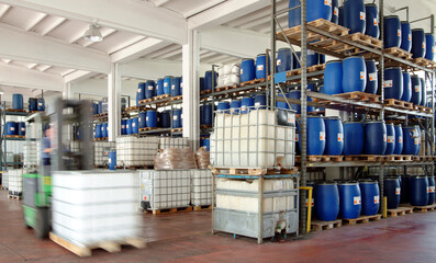 chemical industrial factory - warehouse with a forklift in action

