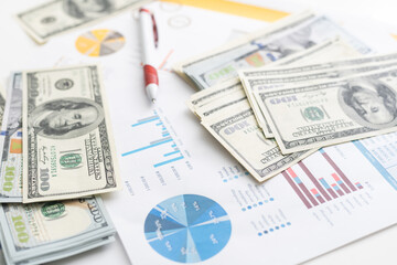 money concept, graph, chart document and pen on desktop.