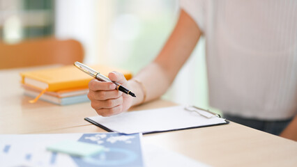 Close-up image, Female writing something on empty paper
