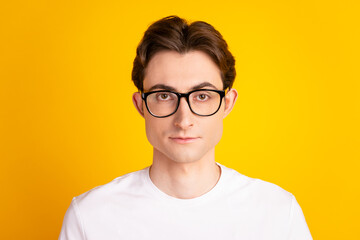 Photo of young handsome man confident eyeglasses economist promoter isolated over yellow color background