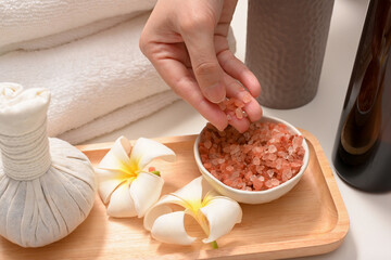 Female hands with Himalaya pink salt. Organic spa treatment