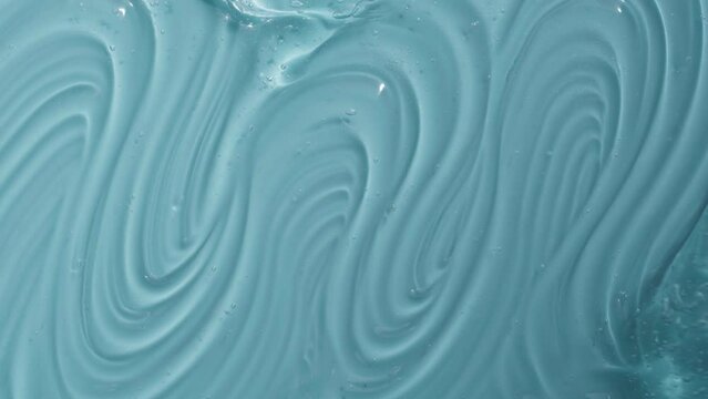 Texture of hyaluronic acid gel texture with bubble footage. Liquid cosmetic skincare blue toner beauty product with peptide and collagen. Turquoise cleanser abstract background video 4k. 