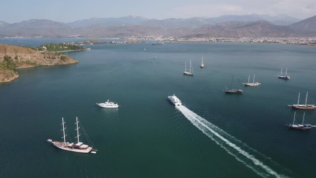 Awesome aerial view of white ship crossing Fethiye Bay, Turkey