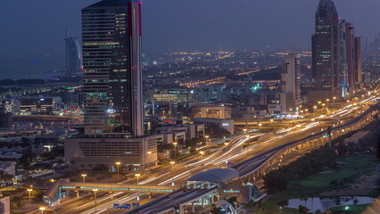 Fototapeta na wymiar Aerial view of Sheikh Zayed Road in Dubai Internet City area night to day timelapse