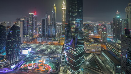 Fototapeta na wymiar Panorama showing futuristic skyscrapers in financial district business center in Dubai night timelapse