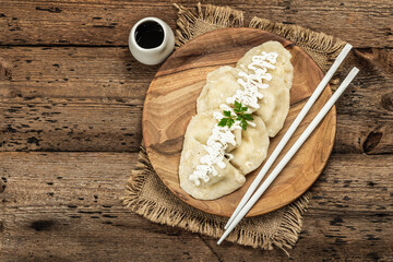 Traditional Dumplings with soy sauce. Traditional Oriental cuisine