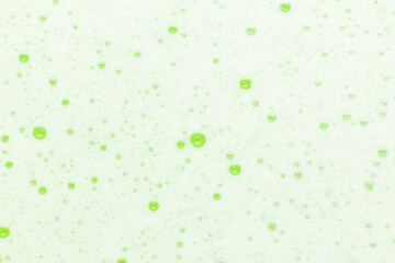 Background from green foam, soap bubbles.