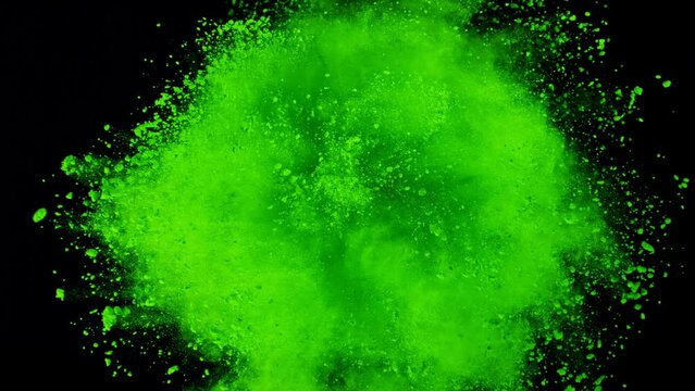 Super Slow Motion Shot of Rotating Green Powder Expolosion Isolated on Black Background at 1000fps.