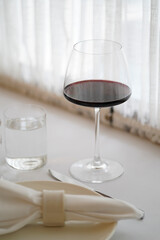 Glass of red wine on restaurant table