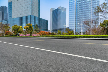 empty road with modern buildings on background, shanghai, china..