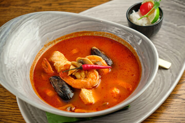 Mediterranean cuisine. Mussel soup with tomatoes and herbs