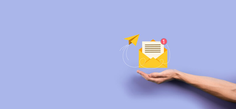 Businessman hand holding letter icon,email icons.Contact us by newsletter email and protect your personal information from spam mail.Customer service call center contact us.Email marketing newsletter.