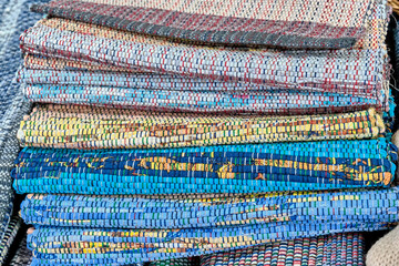 Home colourful woven mats stacked.