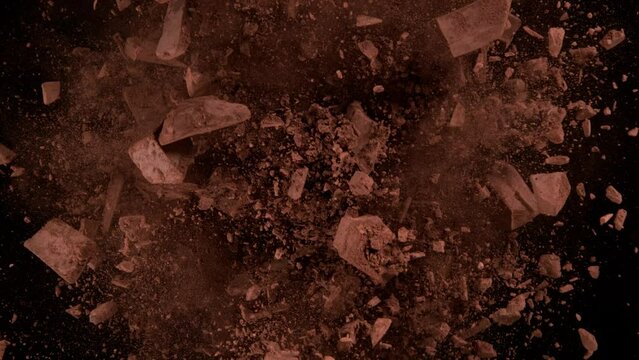 Super Slow Motion Shot of Rotating Chocolate Chunks and Cocoa Powder Explosion at 1000fps.