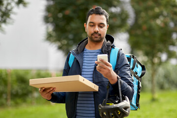 food shipping, profession and people concept - delivery man with thermal insulated bag and takeaway...