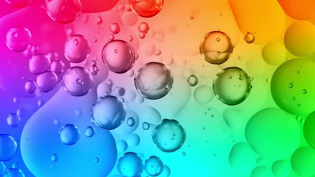 Super Slow Motion Shot of Moving Oil Bubbles on Bright Colorful Background at 1000fps.
