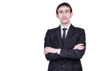 Confident in his abilities, the manager of the company stands with his hands crossed on his chest