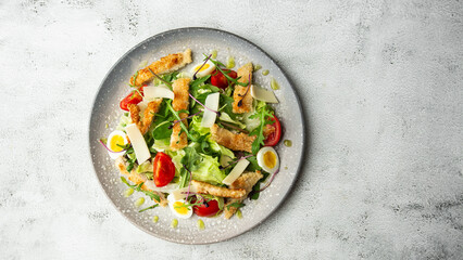 French salad Nicoise with tuna, egg, green beans, tomatoes, olives, lettuce, onions and anchovies on a white background. Healthy food - obrazy, fototapety, plakaty