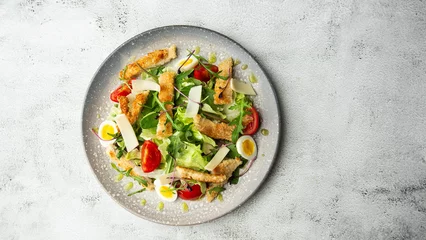 Foto op Plexiglas French salad Nicoise with tuna, egg, green beans, tomatoes, olives, lettuce, onions and anchovies on a white background. Healthy food © MONIUK ANDRII