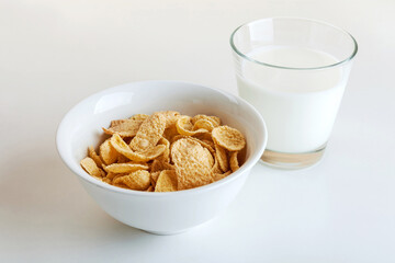 Bowl of cornflake cereals and a glass of milk for breakfast