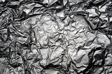 Crumpled food foil close-up background
