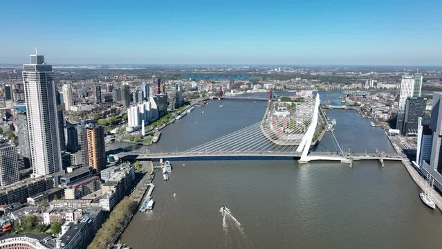 Rotterdam city skyline in The Netherlands drone view of the Maas and office buildings city view. Destination in Holland. Erasmusbrug and river Maas urban city view.
