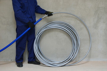Plumber installing plastic pipes