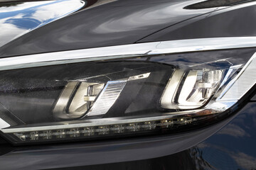 Economical and modern car headlight with LED adaptive light. Close-up, illuminate © HENADZY