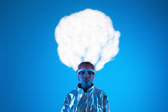 Woman under cloud computing against blue background