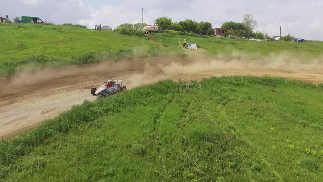 Autocross on a dirt road by car buggy