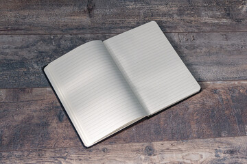 Old notebook with blank pages for text. On an old texture table