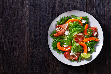 pumpkin salad with lettuce, crumbled cheese, ham